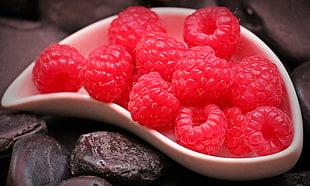 red berries on white ceramic bowl photo