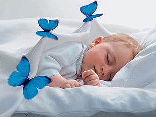 baby lying on bed HD wallpaper