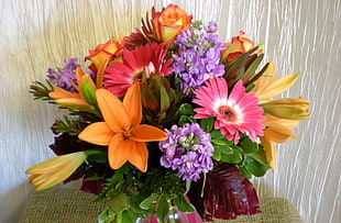 pink, purple, and yellow bouquet of flowers