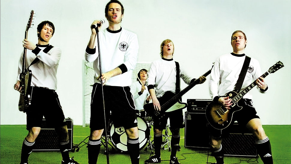 five people playing instrument on soccer field HD wallpaper