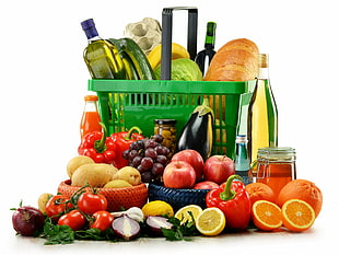 bunch of fruits and vegetables with bottles and bread on basket