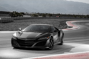 black Acura sports coupe on race track HD wallpaper