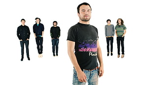 man in black t-shirt in front of group of people