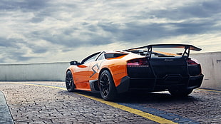 orange and black Lamborghini coupe, car