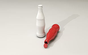 white bottle beside red bottle