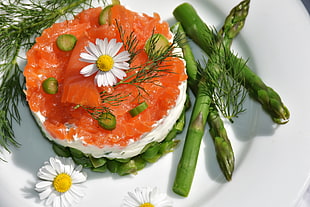 Asparagus and cake on plate