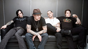 four men sitting on black leather sofa HD wallpaper