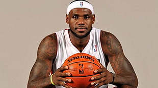 LeBron James holding orange Spalding ball HD wallpaper