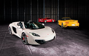 red , white and yellow luxury coupes
