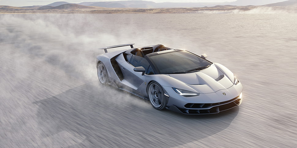 gray Lamborghini car on sand HD wallpaper