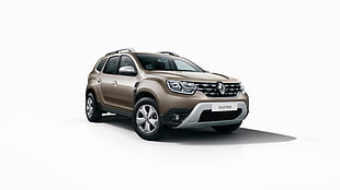 gold Renault SUV with white background