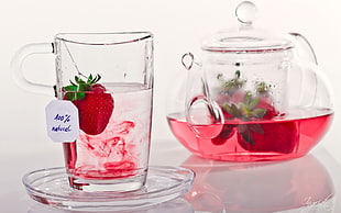 strawberry in filled clear drinking glass