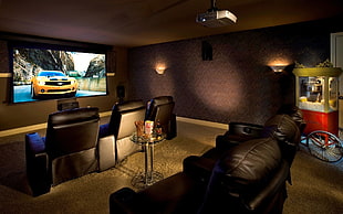 turned on flat screen TV inside brown cinema room, home cinema, indoors, interior design