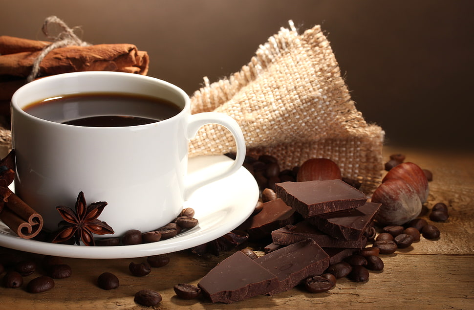white ceramic cup with saucer surrounded with chocolate bars HD wallpaper