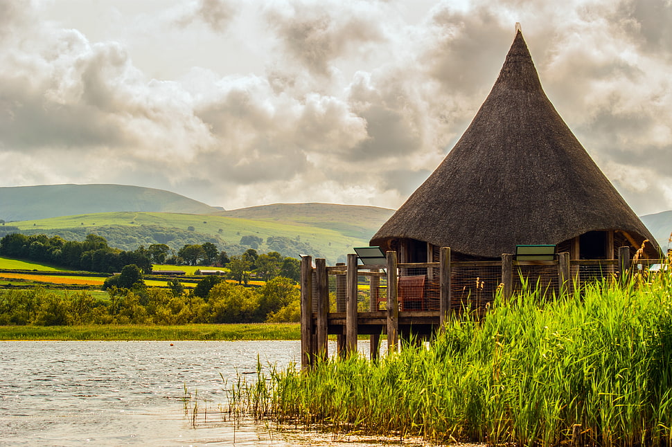 brown wooden hut near body of water, llangorse lake HD wallpaper