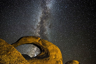 brown stone formation during nighttime HD wallpaper