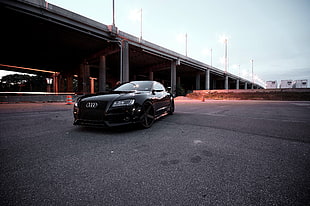 black Audi coupe near bridge