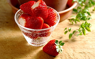 Strawberries on clear glass cup