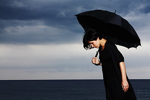 woman holding black umbrella HD wallpaper