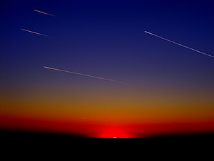 shooting stars passing during sunset