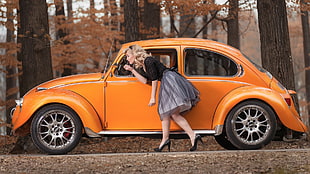 orange Volkswagen Beetle coupe, women, model, blonde, long hair