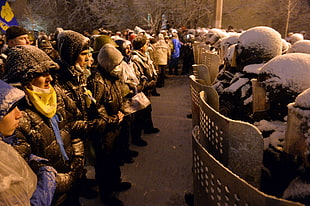 men's black fur hoodie, Ukraine, protestors, soldier, snow