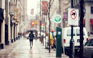 person walking in the rain photo HD wallpaper
