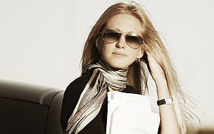 blonde-haired woman wearing brown tint with gray frame sunglasses