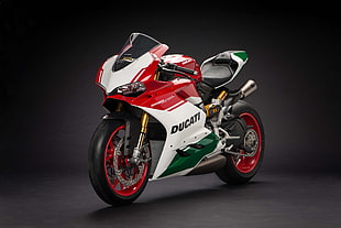 red, green, and white Ducati sports bike