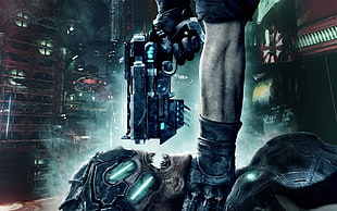 person pointing weapon on monster head poster