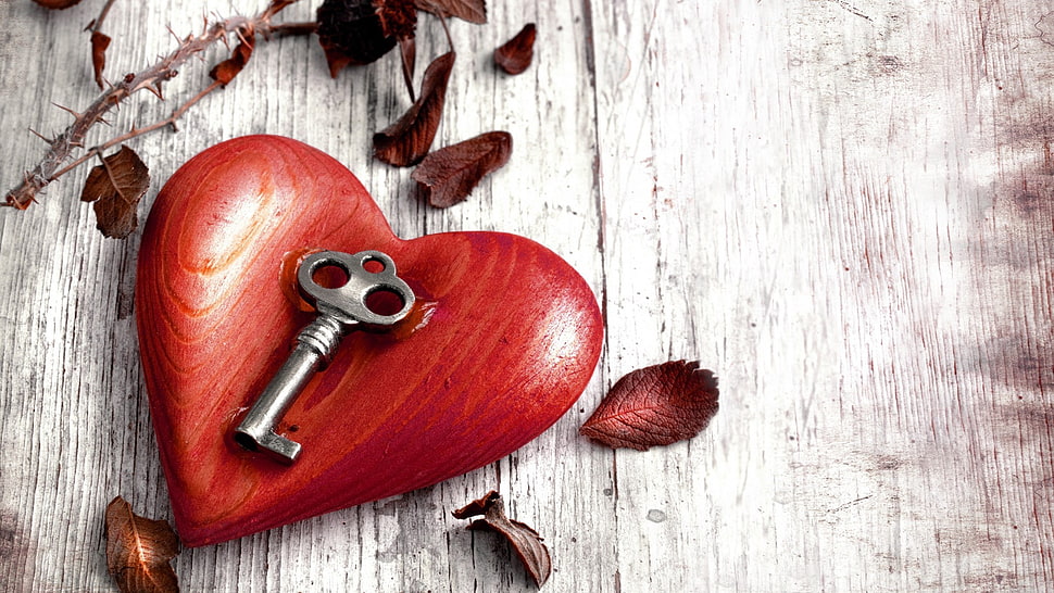 silver key on heart-shaped red wooden table decor HD wallpaper