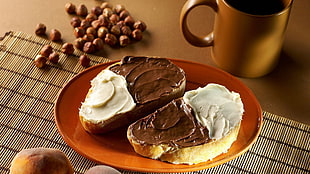 two bread slices with white and chocolate spread