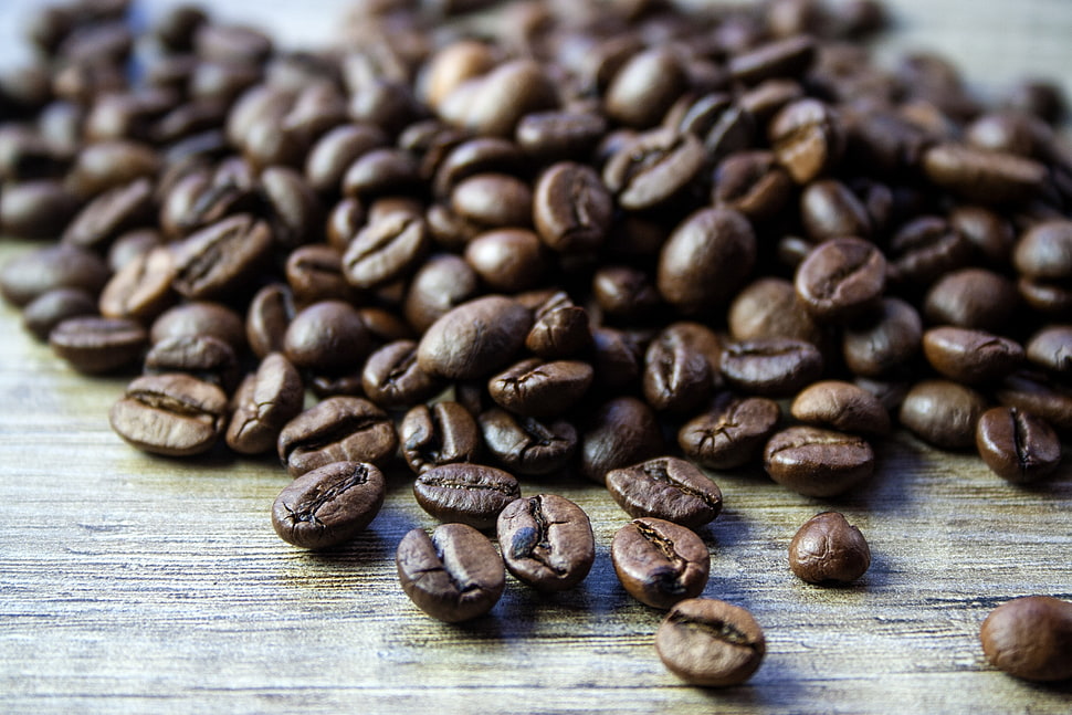 coffee beans on brown wooden surface HD wallpaper