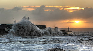 waves crashes to shores photo\, porthcawl