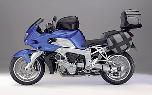 photography of blue and gray sport motor with saddle cargo box HD wallpaper