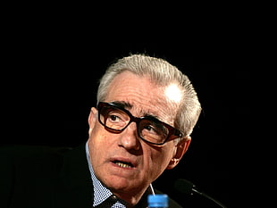 man in black frame eyeglasses
