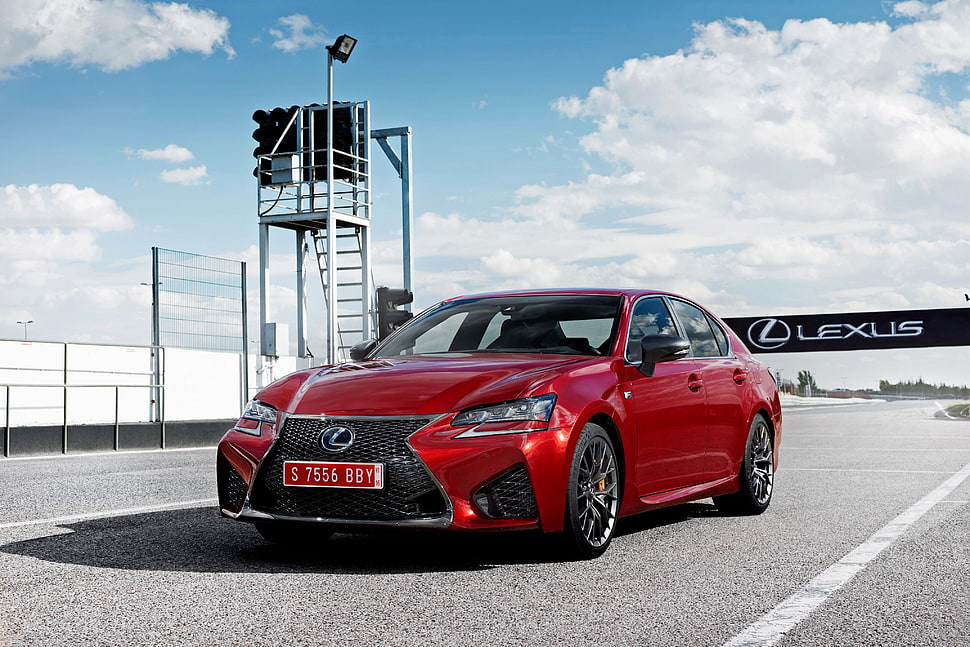 red Lexus sedan on gray concrete road HD wallpaper