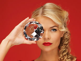 woman holding diamond