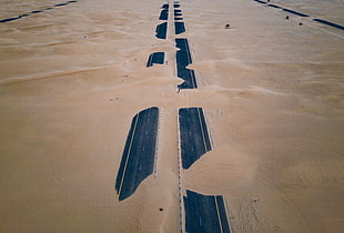 asphalt road covered with sand
