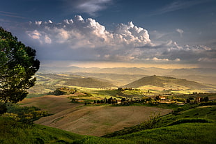 landscape photography of green field and mountains