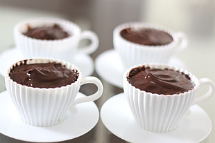 chocolate on white ceramic teacups