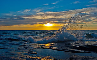 body of water during sunset HD wallpaper