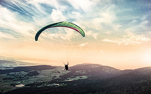 person parachuting under clear sky HD wallpaper