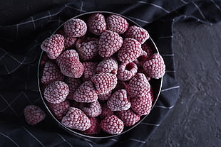 raspberry lot on stainless steel bowl
