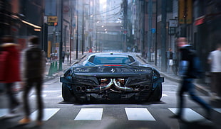 black Ferrari sports car on concrete road with people on street