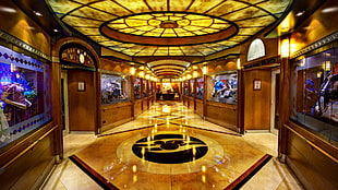 round brown wooden table with chairs, hallway, Disney Cruise Line