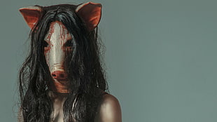 person wearing pig mask