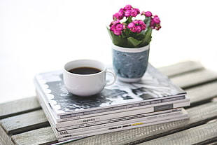 white ceramic cup with coffee on books HD wallpaper