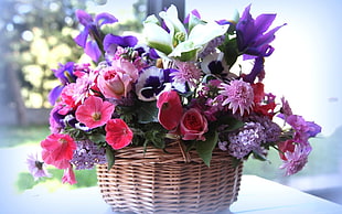 flowers on brown woven basket