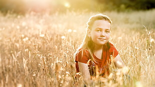 girl sitting in the field